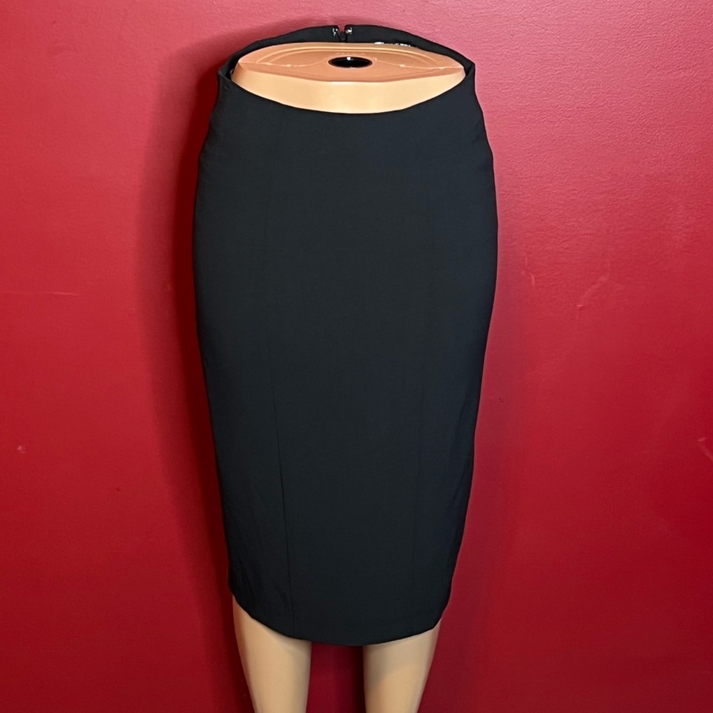 Black fitted skirt with detail back.